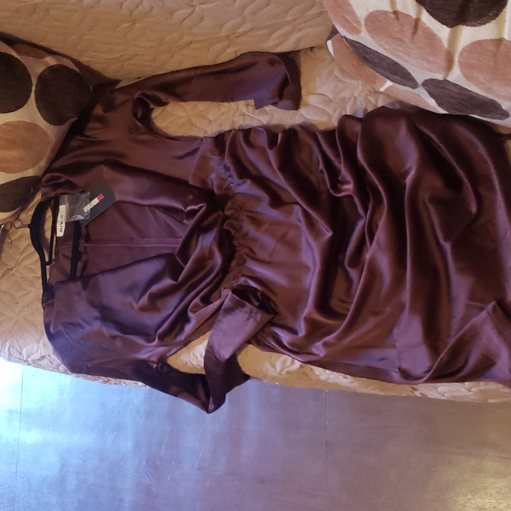 Brown dress with a plunging neckline.